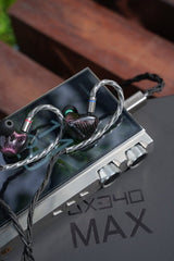iBasso DX340 MAX music player, with earphones, on its box