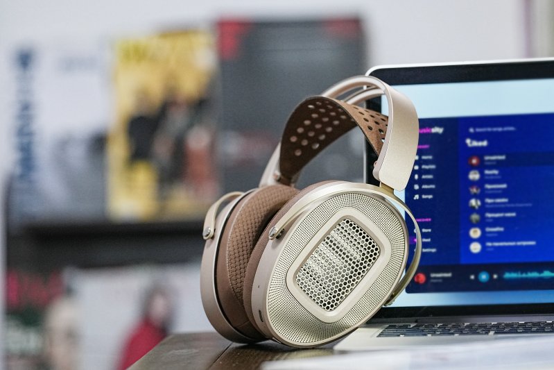 HiFiMAN HE1000 WiFi streaming planar headphones, on a desk beside a laptop