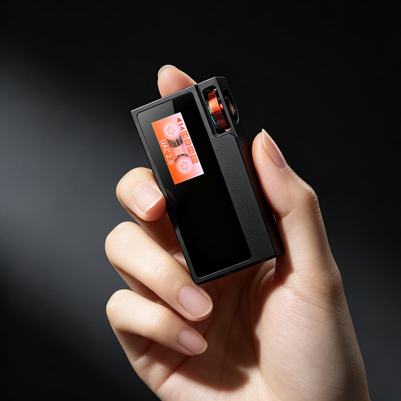 Shanling UA6 II USB DAC and headphone amp, held in the hand