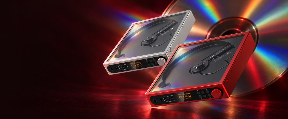 FiiO DM15 CD players in silver and red, in front of a CD splitting light into a rainbow