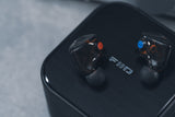 FiiO FX25 in-ear monitors on the NEST CUBE case