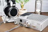 iBasso Kunlun GaN desktop headphone amp, on a desk with headphones
