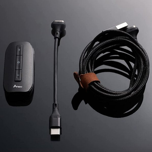 IKKO Zerda ITM01 USB DAC and headphone amp, with its cable on a dark background