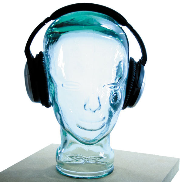 AMP3 glass head headphone stand, clear, with headphones