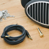 HiFiMAN Edition XS planar headphones, with cable on a desk