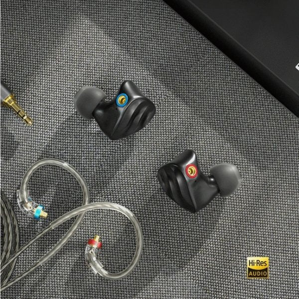 FiiO FH3 in-ear monitors, black, on a dark surface with cable